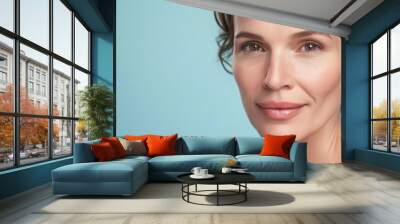 Elegant Woman with a Graceful Smile and Fresh Skin Wall mural