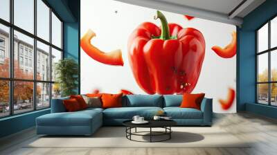 A red bell pepper suspended in the air with its slices falling around, against a clean background, illustrating the freshness and vitality of the vegetable. Wall mural