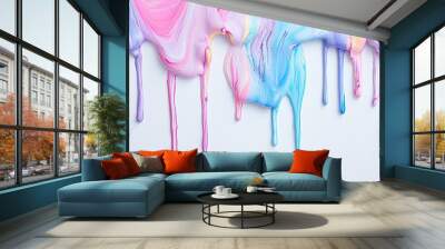 Vibrant pastel paint drips forming colorful streaks on a white backdrop, emphasizing the fluidity of the paint. Wall mural