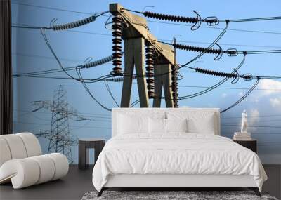 Electricity transmission tower against blue sky Wall mural