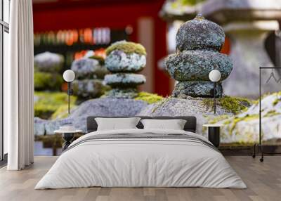 Rows of ancient stone and wooden lanterns Toro covered in moss in Nara Wall mural