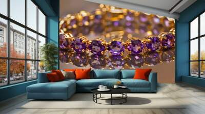 A golden bracelet with beautifully cut amethyst gems, elegantly placed on a reflective gold surface Wall mural