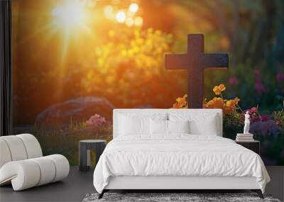 A cross standing tall in a sunlit landscape, with the warm rays of the rising sun casting a golden glow around it. . Wall mural