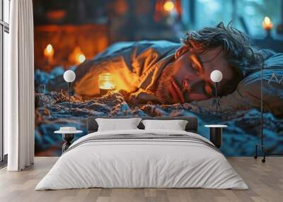 A man lies in bed in his bedroom, his alarm clock next to him... Wall mural