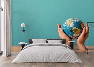 Hands holding a globe, global unity and responsibility. Wall mural