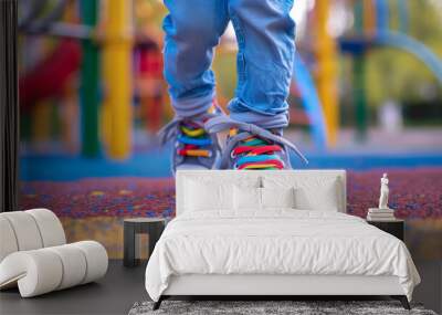 Footwear for children playing on the school playground to support healthy physical development Wall mural