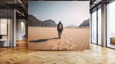 Man with backpack walking alone on sandy beach in mountains Travel lifestyle concept outdoor adventure summer vacation  Wall mural