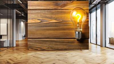 Yellow light bulb with question on daylight lamp against wooden boards, forced perspective Wall mural