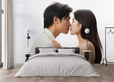 a beautiful heterosexual asian couple kissing and looking in each others eyes. true romantic love. man and woman close to each other. isolated on white background. Generative AI Wall mural