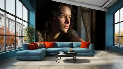 a photo portrait of a beautiful young girl sad and depressed looking out of the window with raindrops on the glass window on a rainy day. astonishing green eyes. Generative AI Wall mural