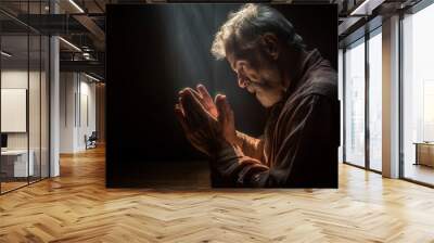 old religious man praying god with his hands sitting on his knees. Generative AI Wall mural