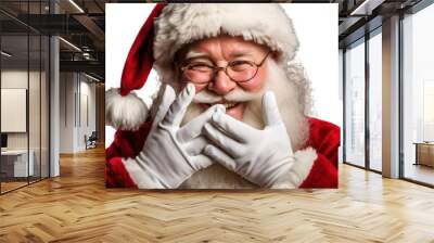 photo of a happy laughing santa claus with his red coat and christmas hat closing his mouth with his hands. isolated on transparent background. png. Generative AI Wall mural