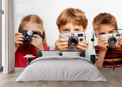 three little kids boy and girls siblings playing with photo cameras and making photography. looking in front of the camera. isolated on white background. Generative AI Wall mural