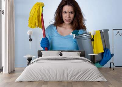 Attractive red haired woman bored and restless of cleaning and housekeeping Wall mural