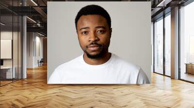 Close up portrait of handsome young man in neutral poker facial expressions and human emotions Wall mural