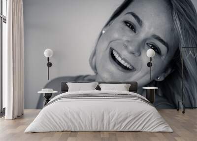 Portrait of an attractive woman with happy and smiling face. In beauty, model and fashion concept Wall mural