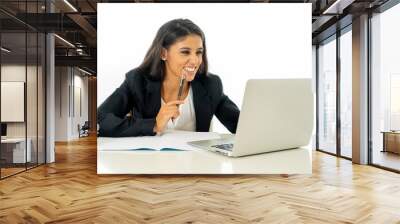 Portrait of attractive young businesswoman working on her laptop looking happy and confident Wall mural