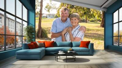 Portrait of elderly senior couple enjoying retirement lifestyle feeling happy aging together Wall mural