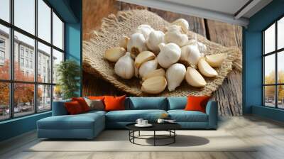 A pile of garlic cloves on a rustic table Wall mural