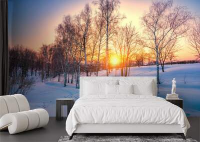 Red sunset in frozen winter forest Wall mural