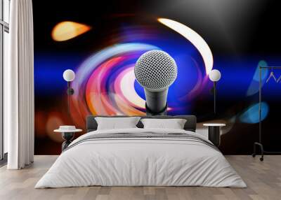 High fidelity microphone with light trail.  Close up of high quality dynamic microphone  on stand with colorful light bokeh in background. Wall mural