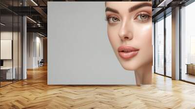 Woman with perfect skin and hair. Skincare or salon beautiful happy girl model with healthy glowing facial and natural makeup with moisturizing cream smile on isolated background with copy space. Wall mural