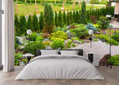 Landscaping panorama of home garden. Landscape design in backyard or yard of residential house. Wall mural