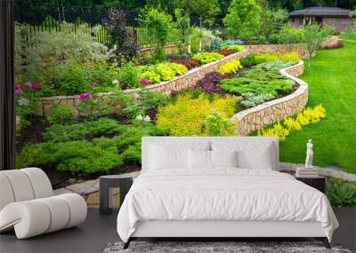 Landscaping panorama of home garden. Landscape design with plants, flowers and stone in backyard.  Wall mural