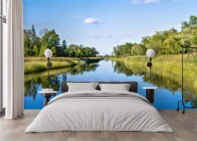 Blue sky reflected in the Mississippi River in Bemidji Minnesota near hiway 2. This scene is a few miles from the source at Lake Itasca with point of view from a boat on the water. Wall mural