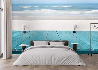 blue wooden table top against beach landscape Wall mural