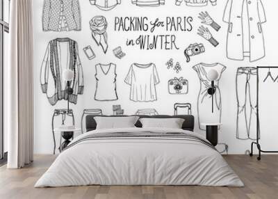 vector illustration of packing for paris in winter. sketch of clothes and accessories for design. bl Wall mural