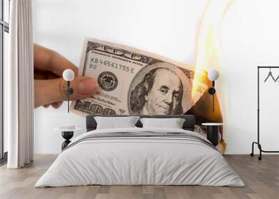 a hundred dollars burn in a fire on a white background Wall mural