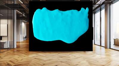 Blue slime isolated on black background Wall mural