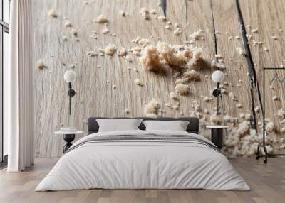 Bread crumbs on a wooden table. Wall mural