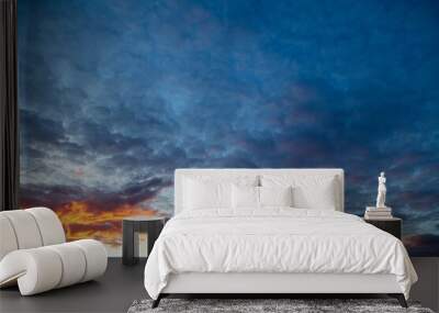 Clouds in the sky at sunset Wall mural