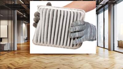 Hands of a worker holding a car air filter isolated on white background Wall mural