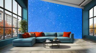 snowing on a blue sky Wall mural