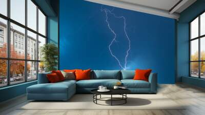 The discharge of lightning in the sky as a background Wall mural