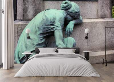 copper sculpture of a mourning woman at a grave Wall mural