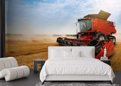 Combine harvester on the wheat field Wall mural