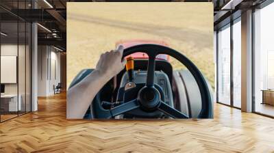 Driving a tractor. First-person view Wall mural