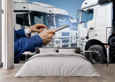 Fleet manager with digital tablet on a background of trucks	 Wall mural