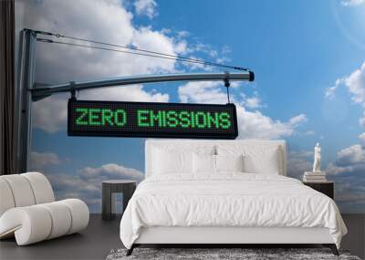 Road information board with text ZERO EMISSIONS on a background of blue sky. Clean mobility concept Wall mural