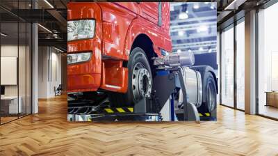 Truck on a column lift in a car service Wall mural