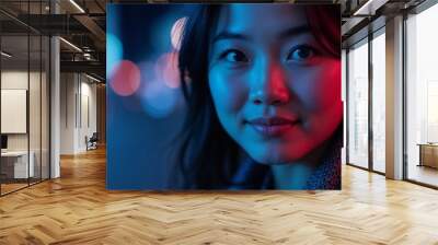 A woman stands in a city at night, illuminated by colorful neon lights. Her expression is calm and inviting, capturing the essence of urban life and nightlife adventure.

 Wall mural