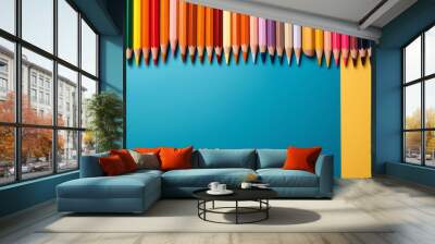 Back to school blue background with a set of colorful pencils and crayons and copy space Wall mural