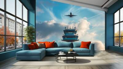 A commercial aircraft flying over an air traffic controller tower. Wall mural