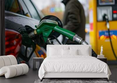 A scene at gas station, a car being refueled with unleaded petrol. Wall mural