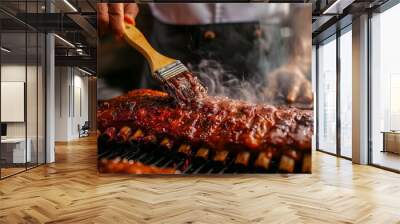 A chef marinating a slab of ribs with a brush, with the grill and smoke in the background. Wall mural