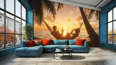 A couple lounging in a hammock suspended between two palm trees, sipping on refreshing cocktails. Wall mural